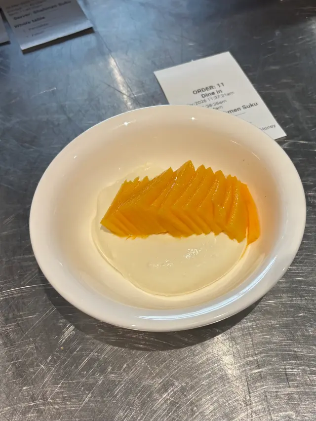 Stirred yoghurt with some mango